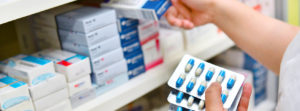 A pharmacist selects medication